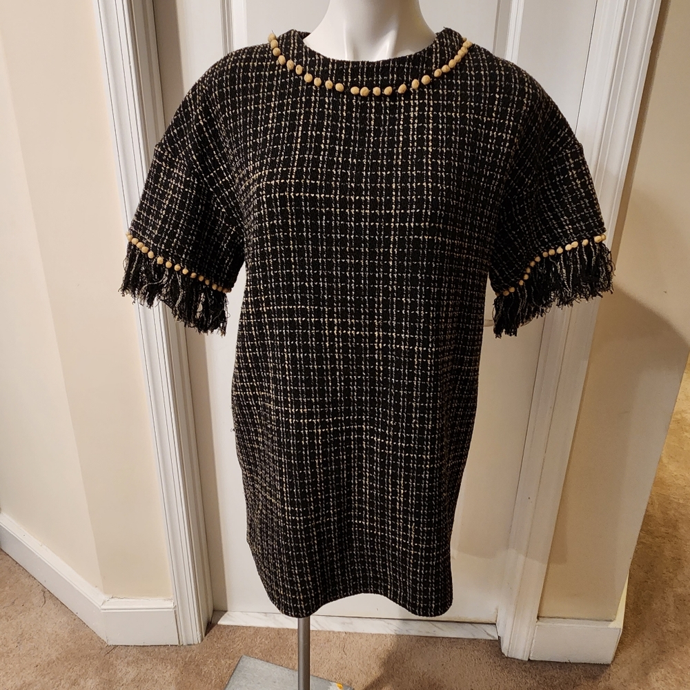 Vici medium dress with unique detail: fringes and balls, cream and black